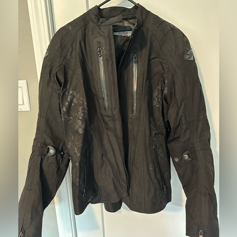 Motorcycle Jacket with padded elbows.